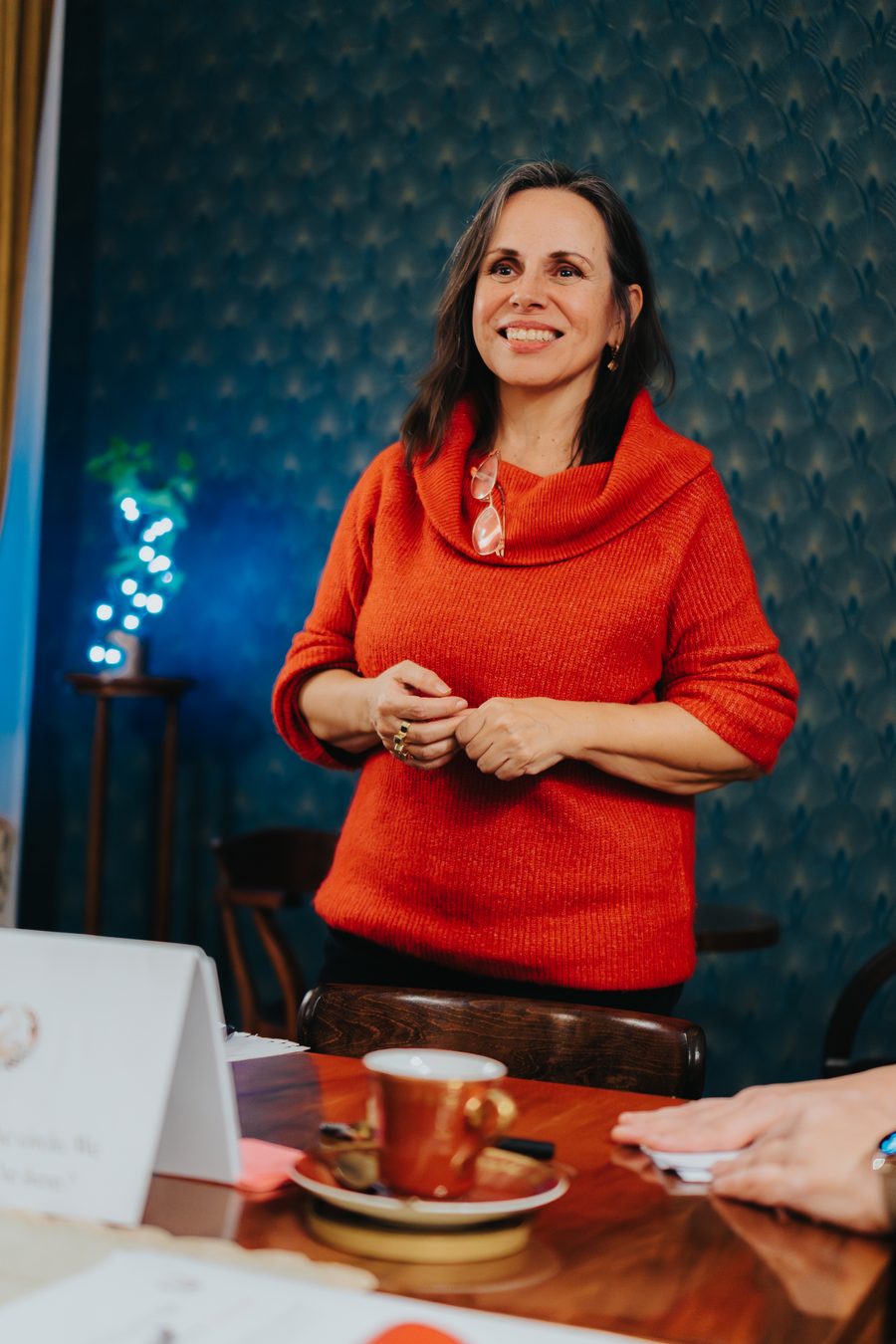 Tamara Medina Sapovalova smiling, standing in a coaching session